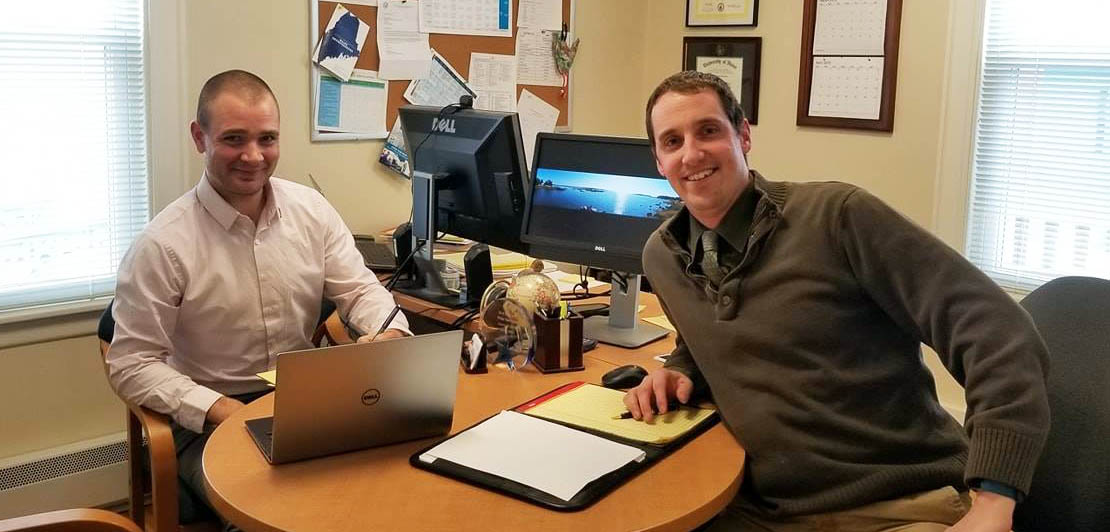 Business Advisor and Client sitting at desk