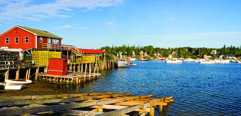 Aquaculture waterfront fishing pier with lobster pots