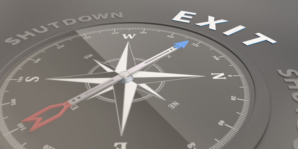 Compass pointing to text that says EXIT