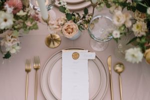 Formal event with table settings, blush tones