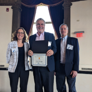 Eric Treworgy, Certified Business Advisor standing with State Director Linda Rossi and Maine SBDC State Director Mark Delisle and Vermont SBDC at NEPD 2023.