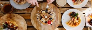 Breakfast table covered in sweet and savory waffles at a Maine Small Business, photo by Sienna Renee Photography