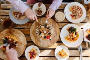 Breakfast table covered in sweet and savory waffles at a Maine Small Business, photo by Sienna Renee Photography