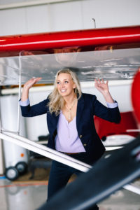 Chelsie Crane of Crosswind Investments with airplane
