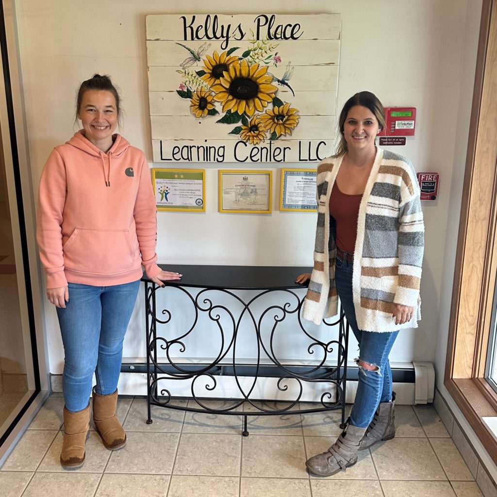 Business owners near sign leading into daycare in Presque Isle, Maine