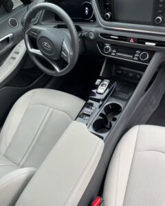 Inside of a clean car with gray seats and black interior. Detail done by Black Diamond Detailing.
