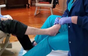Close view of a nurse treating someone's feet