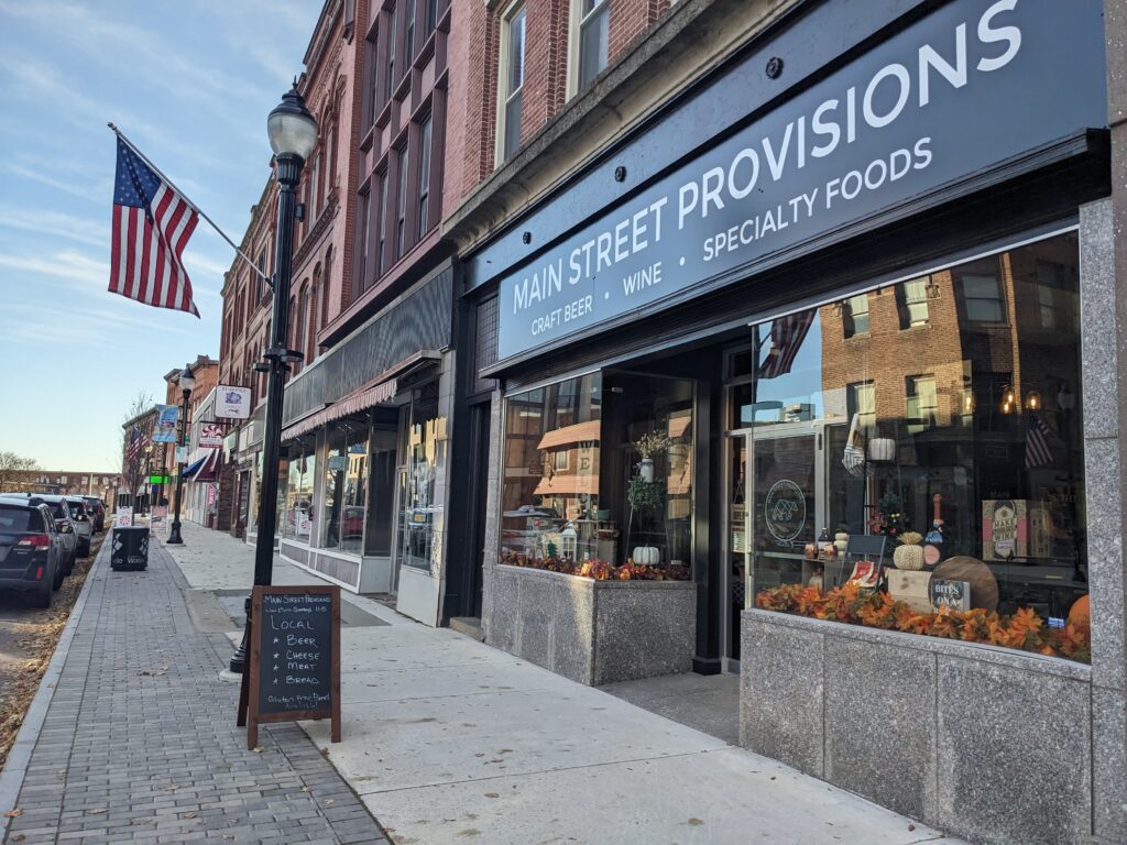 Outside of building of Main Street Provisions with large business sign and glass windows