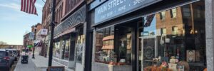 Outside of building of Main Street Provisions with large business sign and glass windows