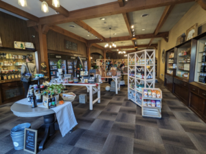 Inside of Main Street Provisions with lots of shelves filled with locally and regionally sourced food, beverages and gifts