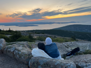 People enjoying sunset on the top of Cadillac Mountain