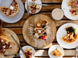 Delicious variety of sweet and savory waffles at Peace, Love, Waffles