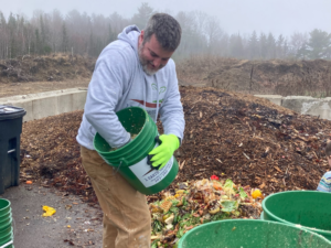 Matt Saunders working at composting business, 1 Earth Composting