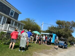 Crowd and line in front of Palette Creperie's food truck on Monhegan Island during their first summer season